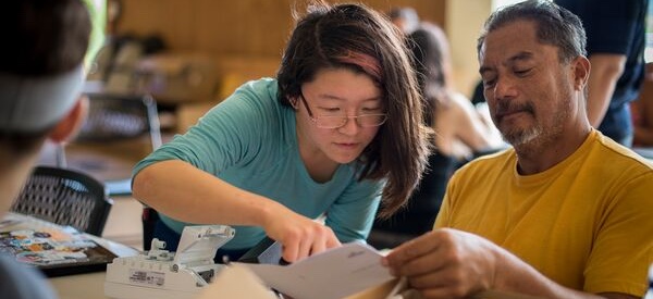 A man and woman collaborating on a project